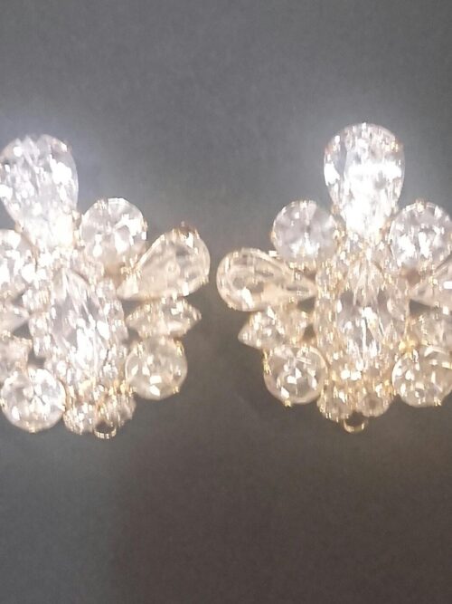 Conjunto de broches dorado y cristal